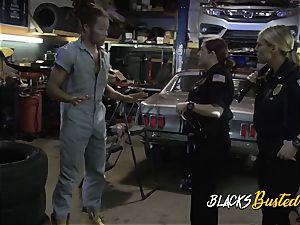 Mechanic gets visited by nasty milf cops willing to take his humungous implement